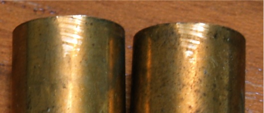 Brass casings with scratch marks visible